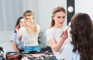 visagiste-creating-professional-makeup-woman-studio